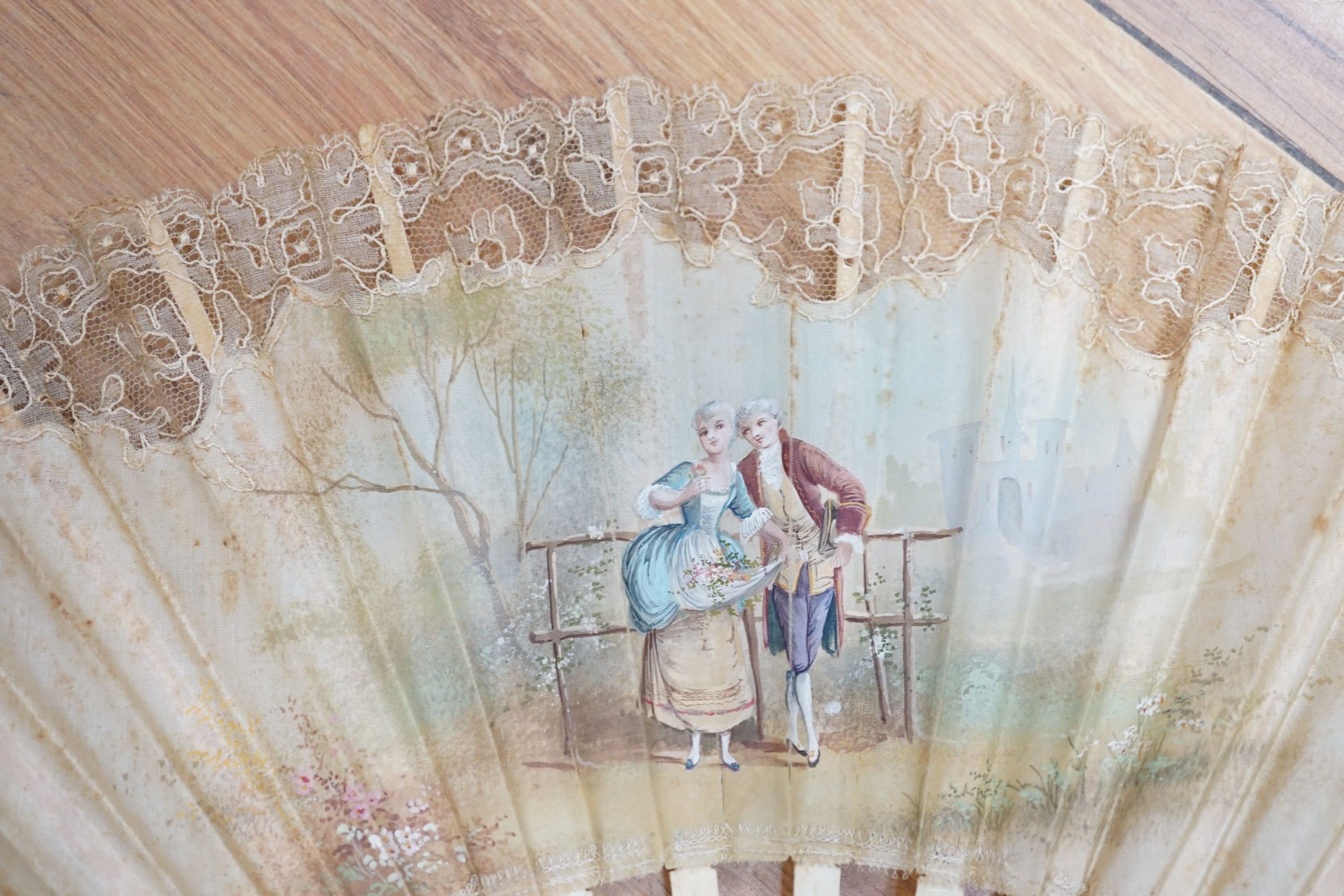 Five various fans, and an 18th century painted leaf fan with ivory chinoiserie decorated guards and sticks, 28 cms high (6)